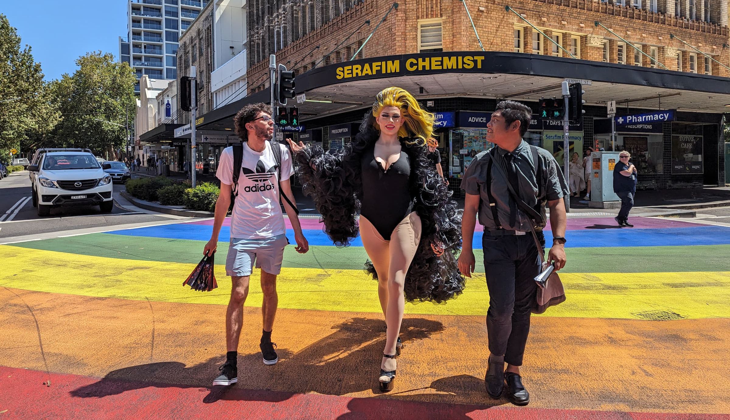 rainbow crossing with drag queen